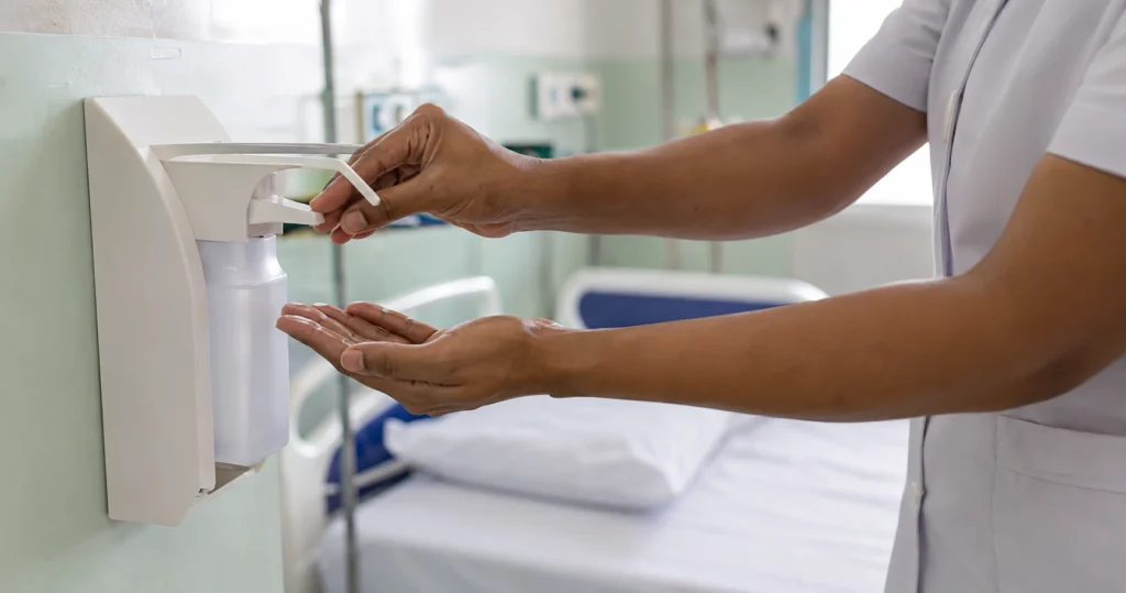 Nurse auditing hand-hygiene compliance